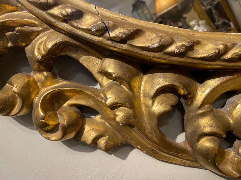 Early carved giltwood oval mirror View IV