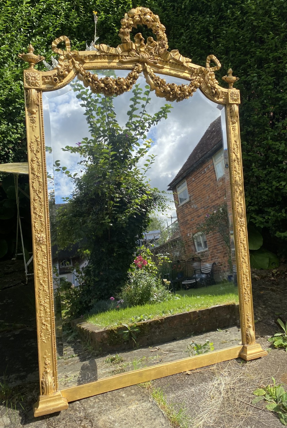 Decorative mirror with swags and garlands