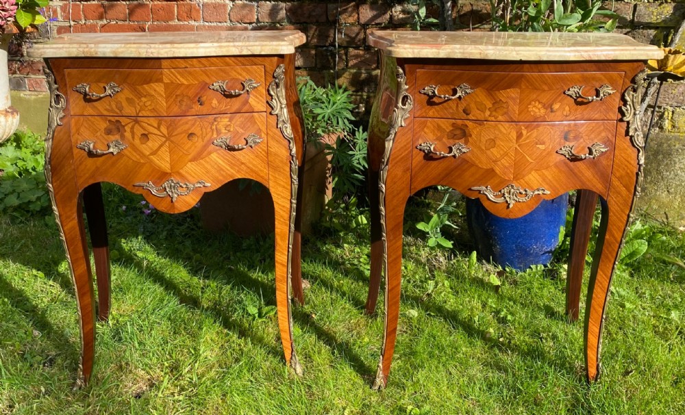 A pair of marquetry bedside tables 