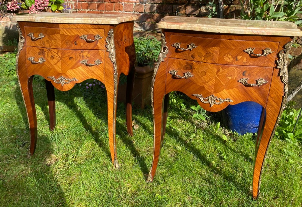 A pair of marquetry bedside tables  View II