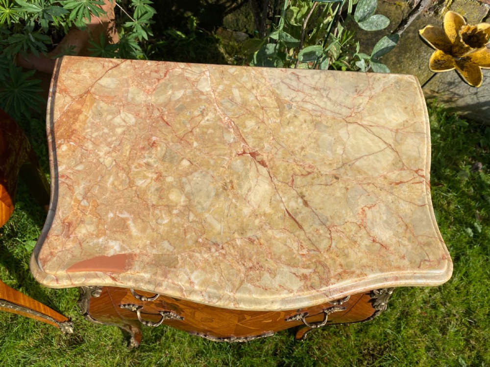 A pair of marquetry bedside tables  View V