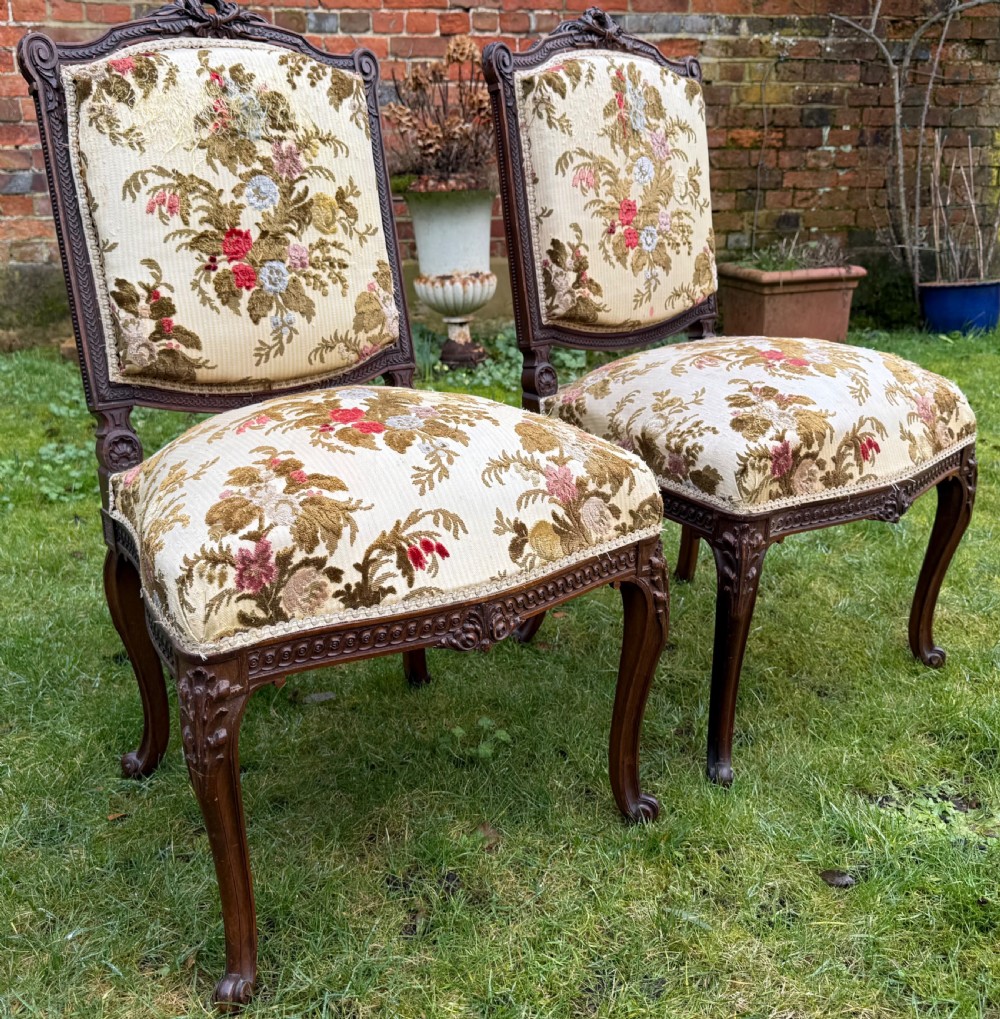 Pair of finely carved side chairs  in mahogany 