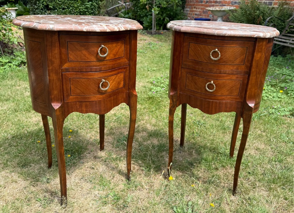 Pair of French oval bedside tables 