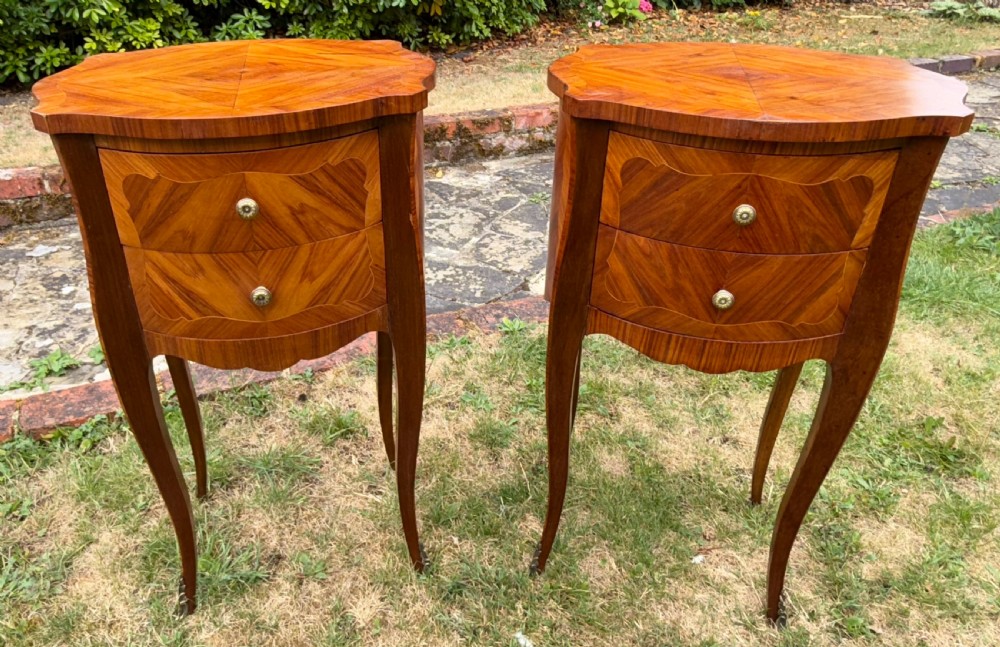 Pair of oval French bedside tables