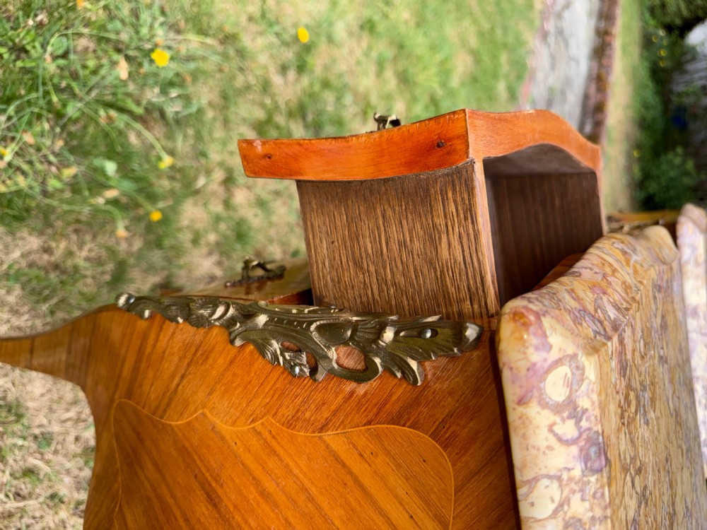 Pair of French Rococo style bedside tables featuring floral wood marquetry, curved cabriole legs, gilt metal mounts, and polished marble tops. View III
