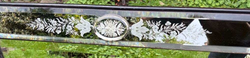 A large rectangular Venetian cushion mirror featuring engraved botanical designs, bevelled edge panels, and decorative glass rosette mountings. View III