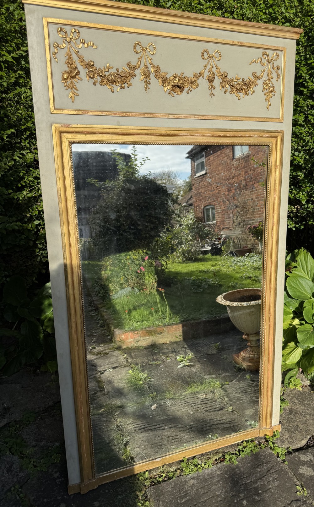 A painted and gilt Trumeau mirror 
