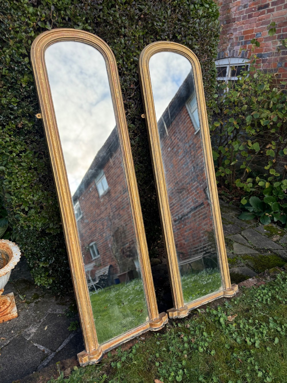 Pair of large 19th Century rubbed gilt mirrors. View VI