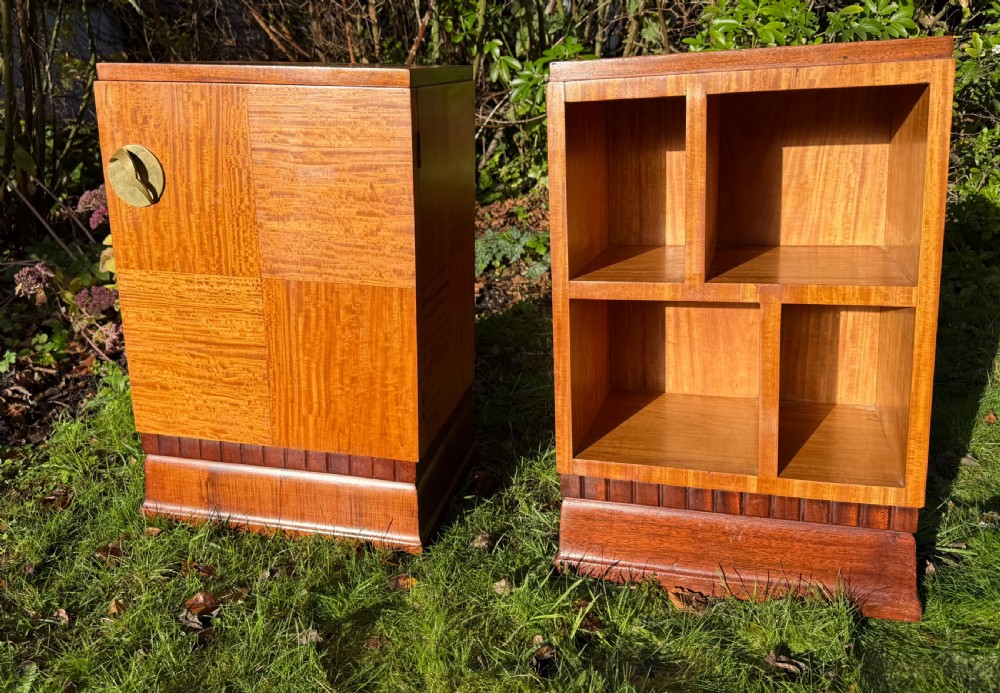 A pair of Art Deco wooden bedside tables featuring checkerboard veneer patterns, with one cabinet unit and one open geometric shelving unit. View VII