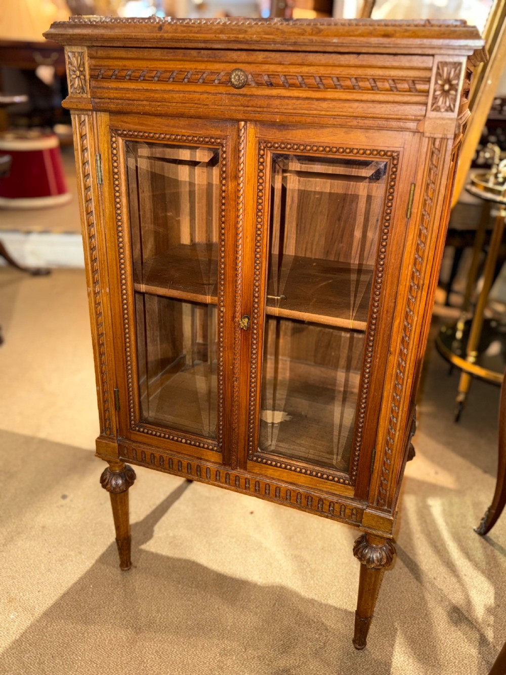 A pair of small walnut glazed cabinets  View VII