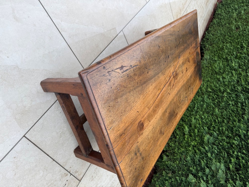 A large 18th-century rectangular walnut coffee table featuring a patinated wood top, a single carved central drawer with a circular brass handle, and a scalloped apron. View VIII