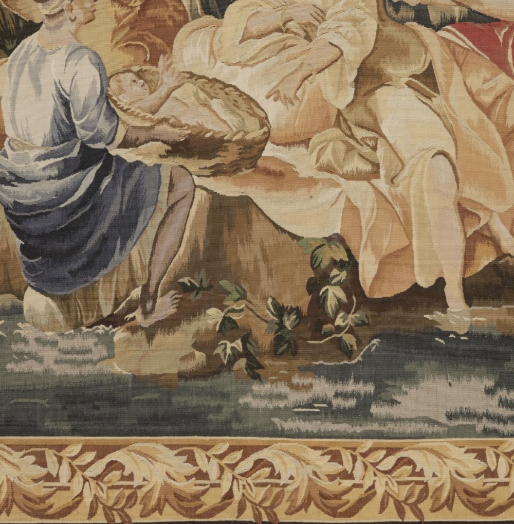 A large rectangular 19th-century French Aubusson style woven tapestry depicting figures under palm trees within a decorative foliage border. View VIII