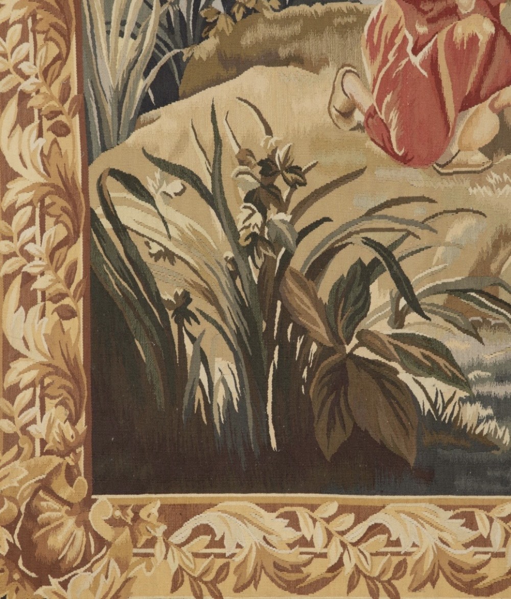 A large rectangular 19th-century French Aubusson style woven tapestry depicting figures under palm trees within a decorative foliage border. View X