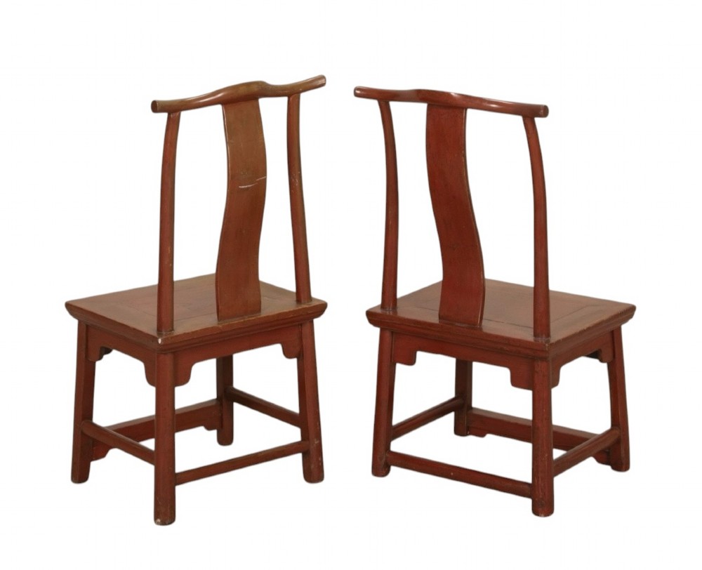A matched pair of 19th-century Chinese side chairs featuring curved yoke top rails, carved central back splats, square timber seats, and a reddish-brown lacquered finish. View IV