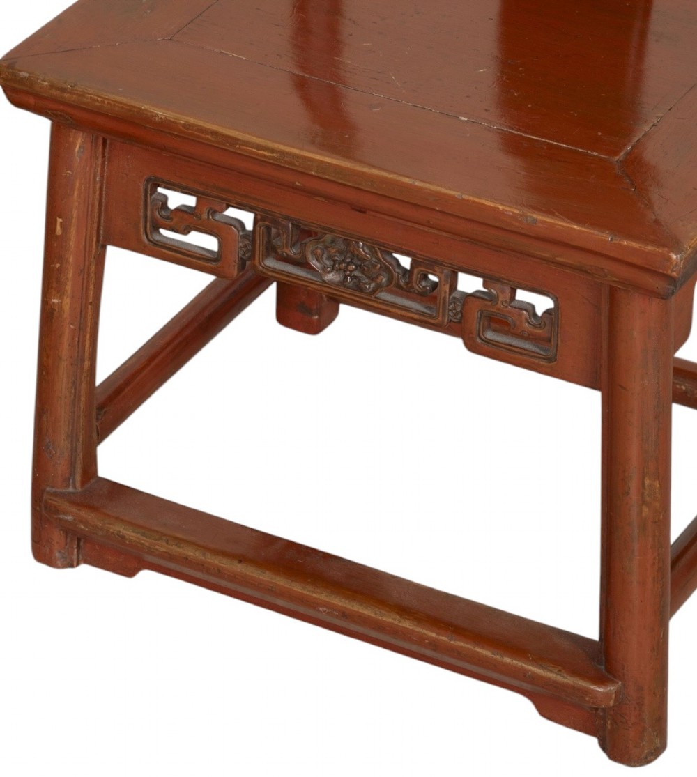 A matched pair of 19th-century Chinese side chairs featuring curved yoke top rails, carved central back splats, square timber seats, and a reddish-brown lacquered finish. View VII