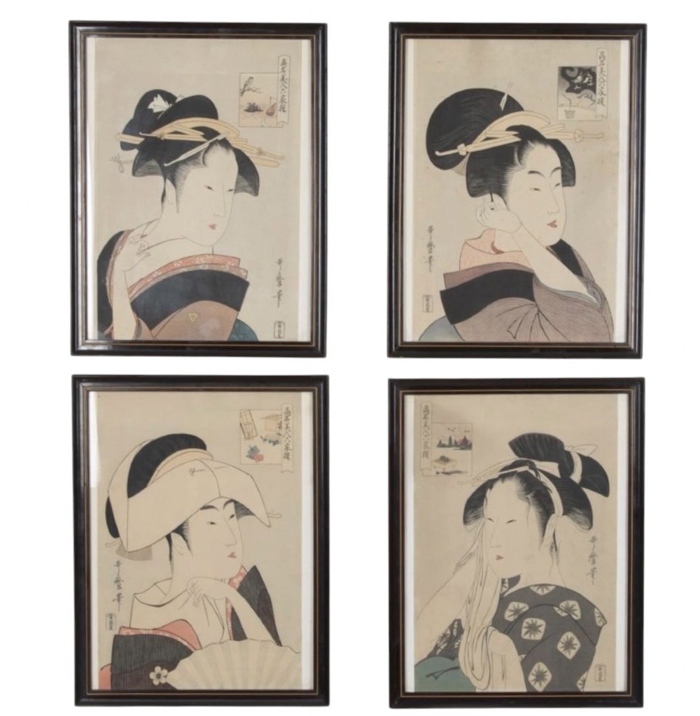 A set of four dark-framed Japanese ukiyo-e woodblock prints depicting traditional female portraits in muted tones on cream paper.