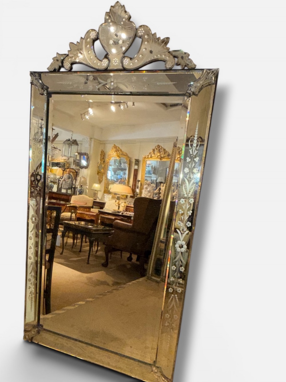 A large rectangular Venetian wall mirror featuring etched floral border panels, bevelled glass edges, and a prominent scrolling glass crest. View II