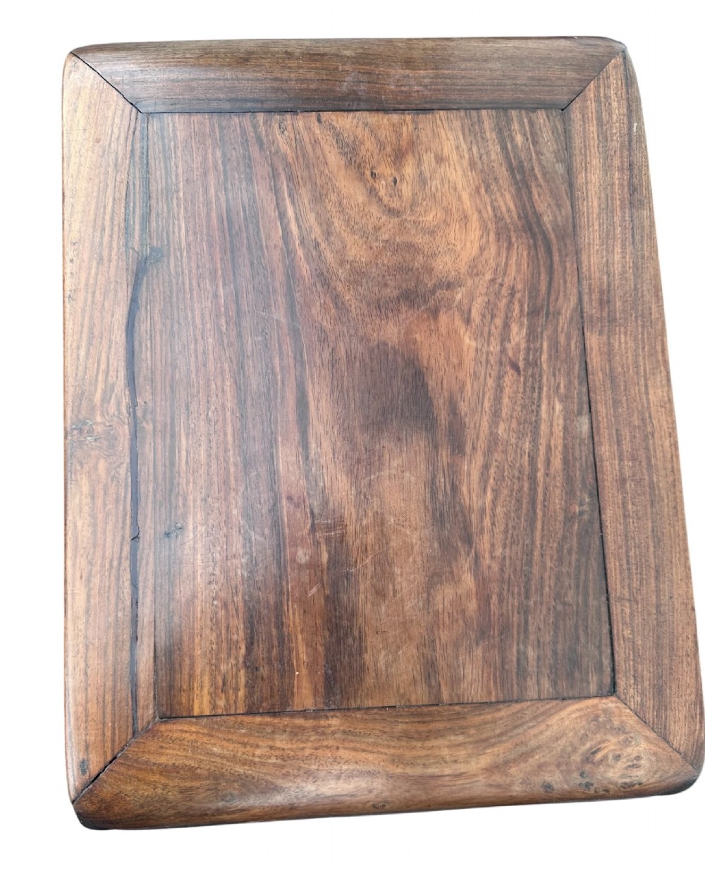 A pair of 19th-century carved dark hardwood side tables with scrolled tops and pierced floral aprons. View IV