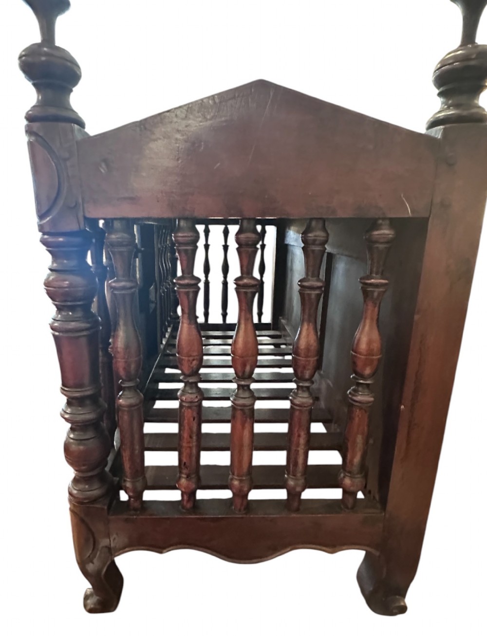 An 18th-century French fruitwood panetiere bread cage featuring turned wood balusters, carved pediment finials, and a central cupboard door with an inlaid star and iron hardware. View II