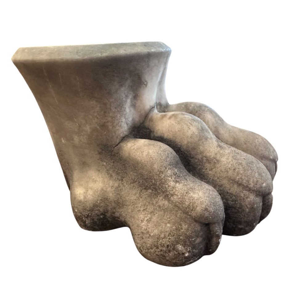 A carved light grey Carrara marble lions paw foot with detailed claws and a rounded collar base. View II