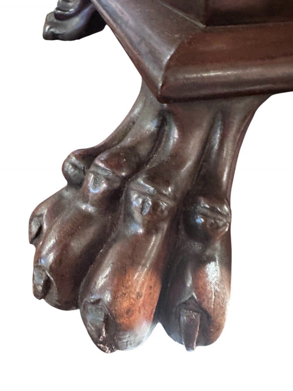 An 18th-century Georgian mahogany sarcophagus-form cellarette featuring a hinged stepped lid, brass escutcheon, and carved paw feet. View II
