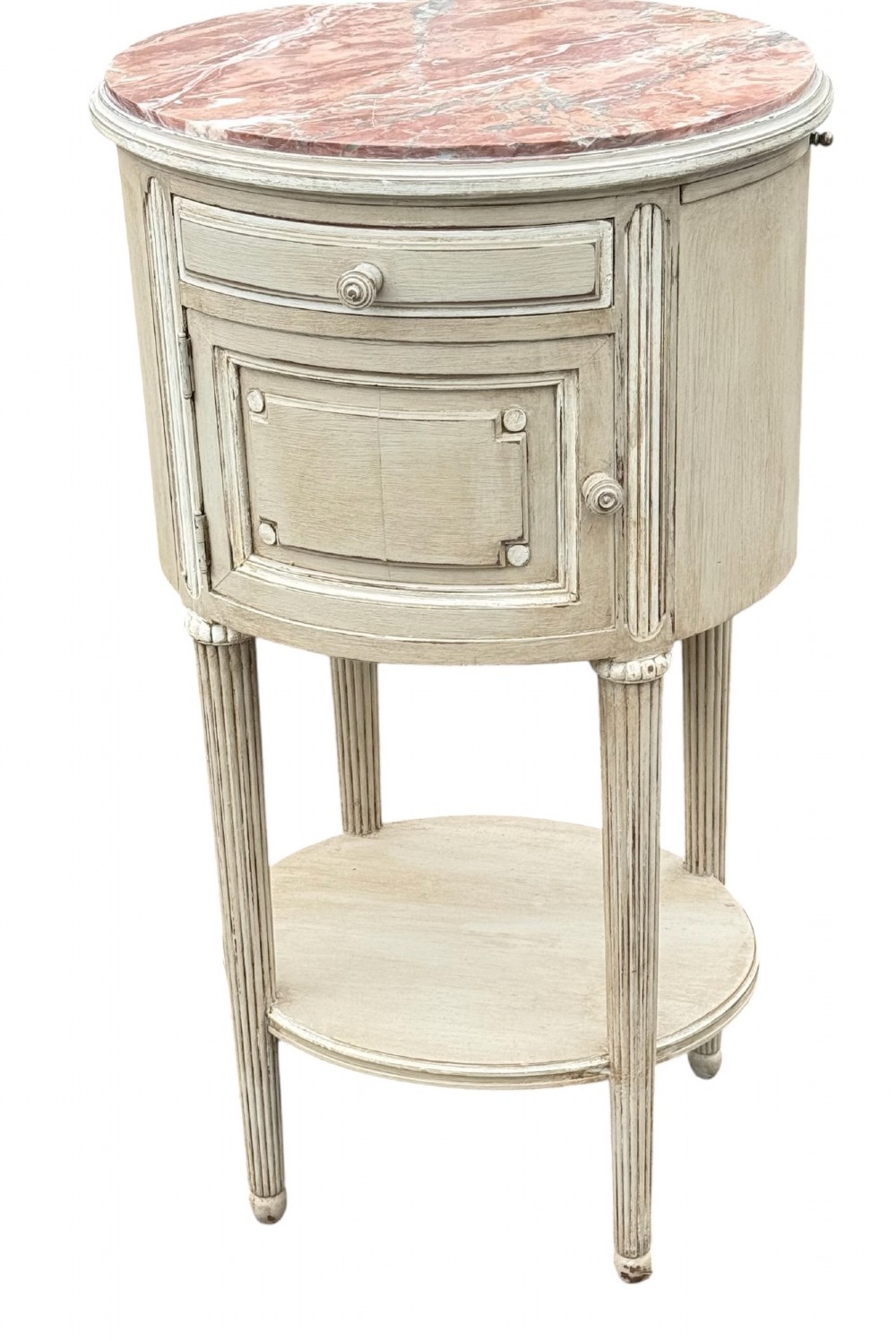A pair of round 19th-century French painted bedside tables with pink marble tops, single drawers, cupboards, and fluted legs with a lower shelf. View III
