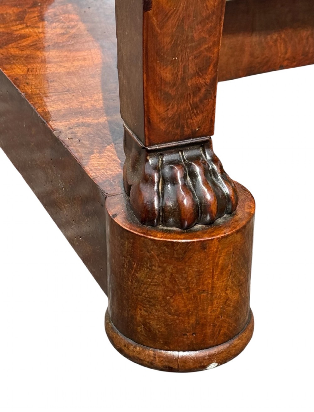 A 19th-century French Louis Philippe mahogany console table featuring a grey marble top, single frieze drawer, curved scroll front legs with acanthus carvings, and an incurved plinth base. View V