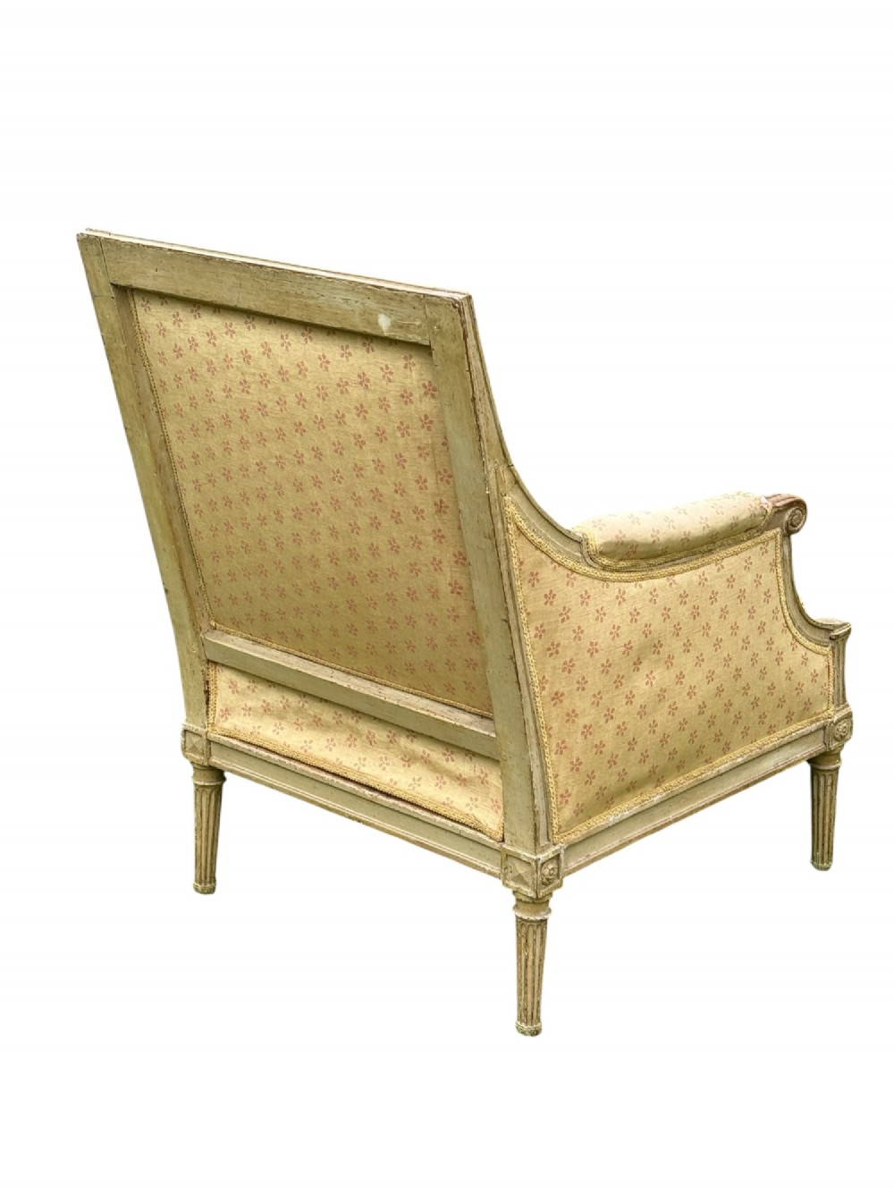An 18th-century French Louis XVI armchair featuring a distressed grey painted wooden frame with fluted tapered legs and cream patterned upholstery. View III