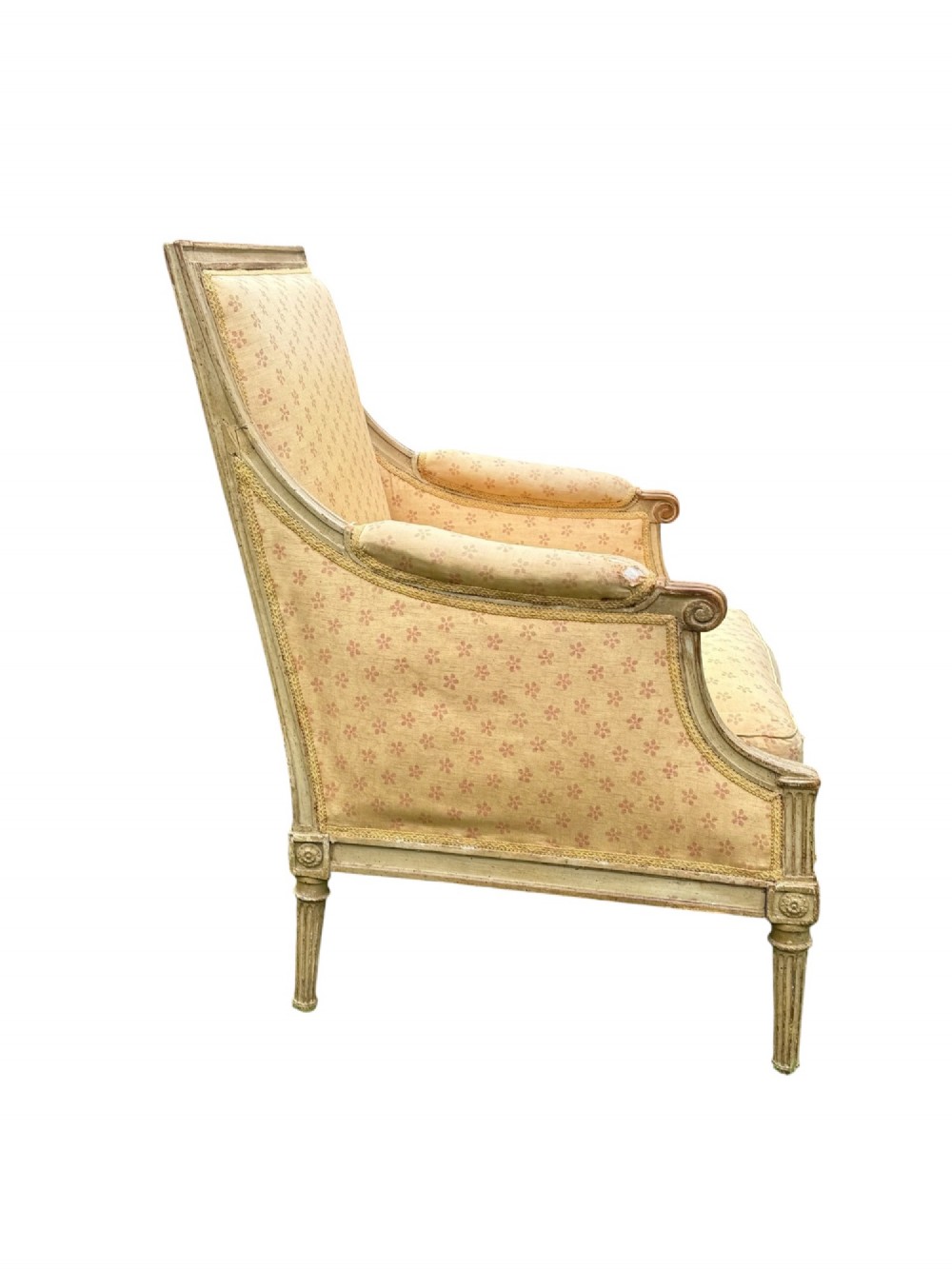 An 18th-century French Louis XVI armchair featuring a distressed grey painted wooden frame with fluted tapered legs and cream patterned upholstery. View IV