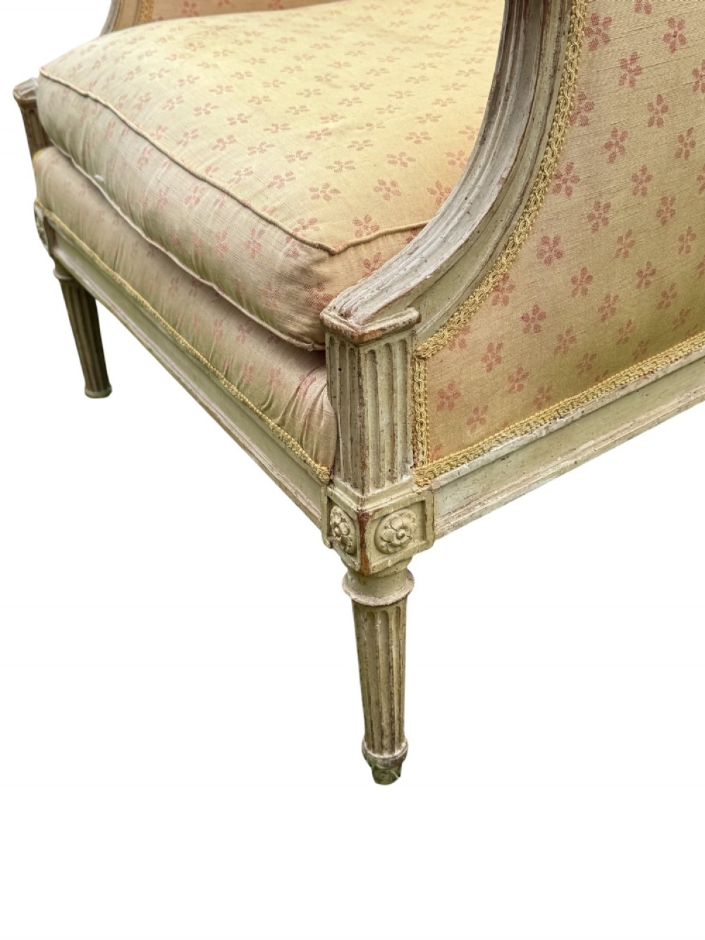 An 18th-century French Louis XVI armchair featuring a distressed grey painted wooden frame with fluted tapered legs and cream patterned upholstery. View VI