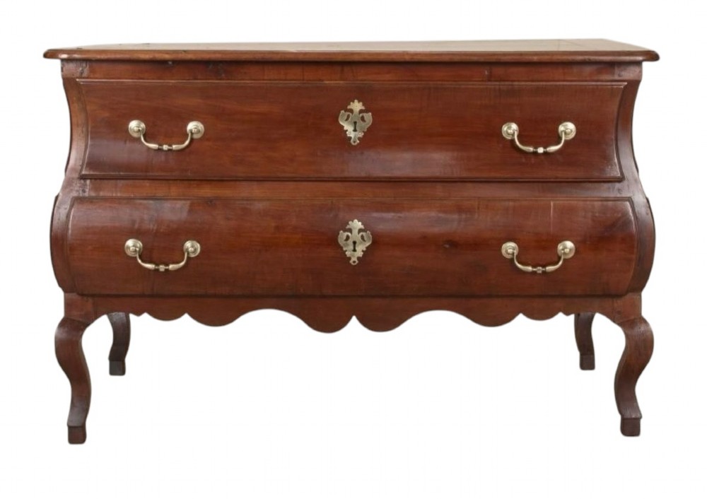 An 18th-century French cherrywood sauteuse commode featuring two drawers, brass escutcheons, a scalloped apron, and cabriole legs.