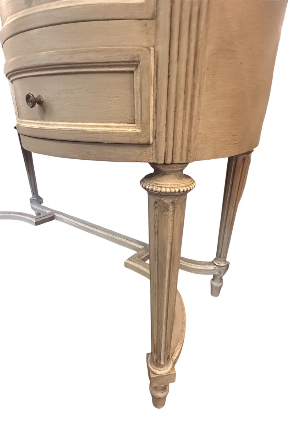 An off-white painted Edwardian kidney-shaped dressing table featuring five drawers, fluted legs, a glass inset top, and an attached triple oval mirror decorated with carved ribbon cresting. View IV