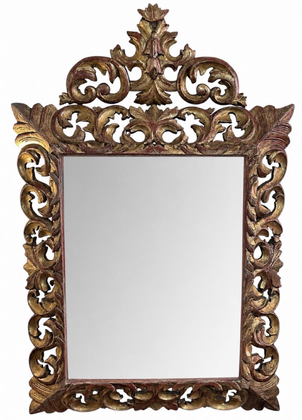 A rectangular 19th-century French Rococo style wall mirror featuring an openwork carved giltwood frame with scrollwork, acanthus leaf detailing, and a crested pediment.