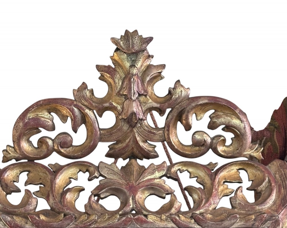 A rectangular 19th-century French Rococo style wall mirror featuring an openwork carved giltwood frame with scrollwork, acanthus leaf detailing, and a crested pediment. View II