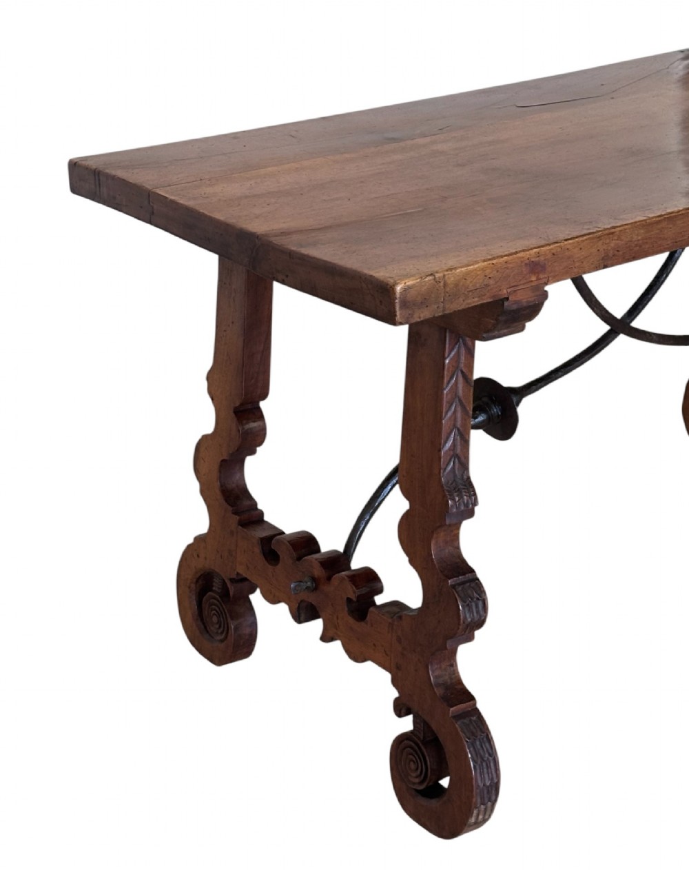 A nineteenth-century Spanish walnut dining table featuring carved lyre-shaped trestle legs and curved wrought iron stretchers. View V