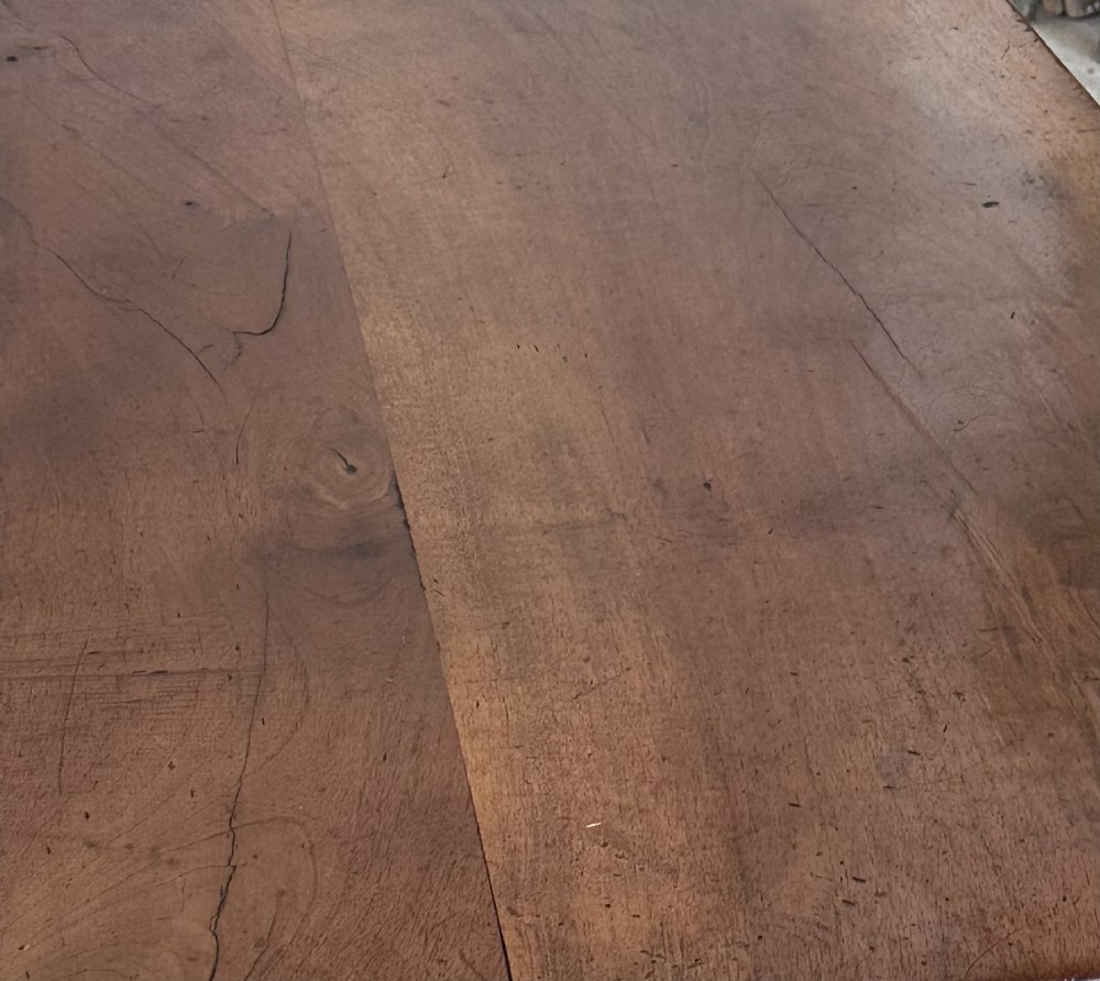 A nineteenth-century Spanish walnut dining table featuring carved lyre-shaped trestle legs and curved wrought iron stretchers. View VI