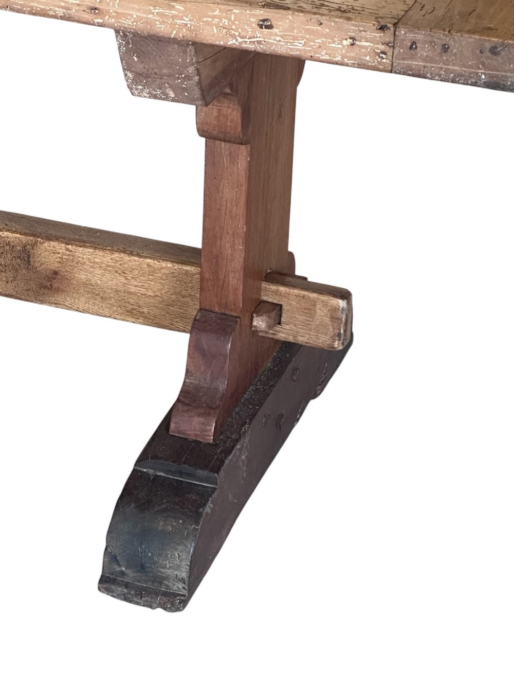 An 18th-century French refectory dining table constructed from beech timber with a solid plank top and a trestle base connected by a low stretcher. View VI