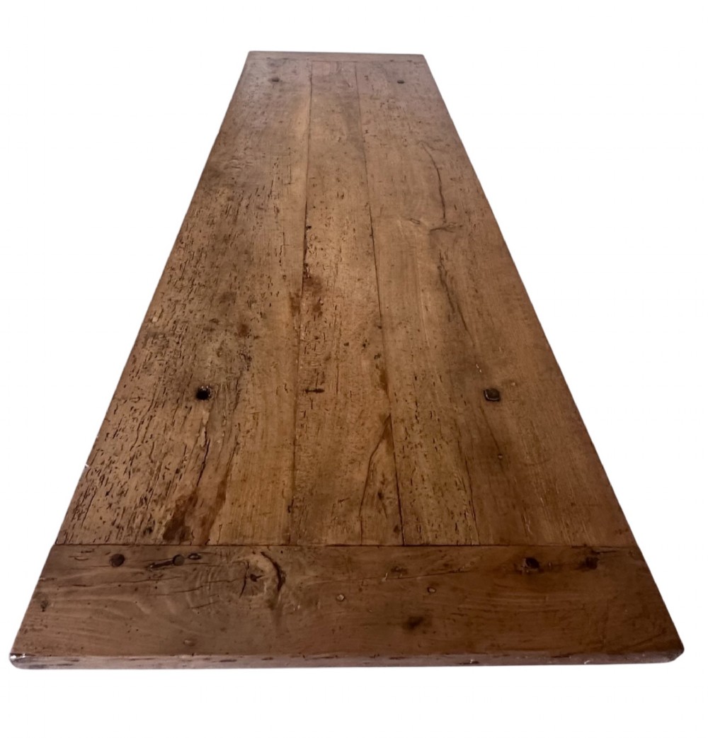 An 18th-century French refectory dining table constructed from beech timber with a solid plank top and a trestle base connected by a low stretcher. View VII
