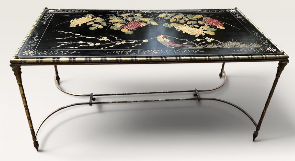 A rectangular mid-century low table featuring a faux-bamboo brass frame, X-form stretchers, and a black lacquered top decorated with colourful Chinoiserie floral patterns. View III