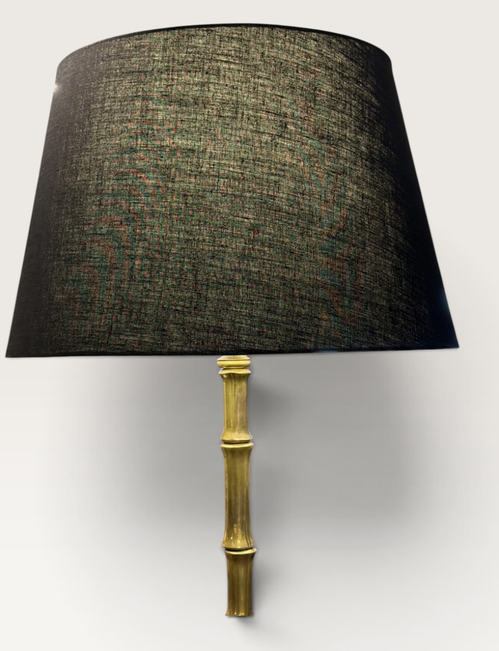 A tall brass floor lamp featuring a faux bamboo stem on a curved tripod base, topped with a cylindrical black woven fabric lampshade. View VI