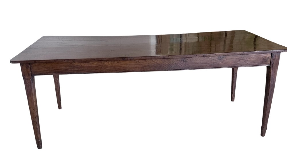 A large nineteenth-century French oak farmhouse table featuring a rectangular plank top, a frieze drawer with a wooden knob, and four tapered square legs. View V