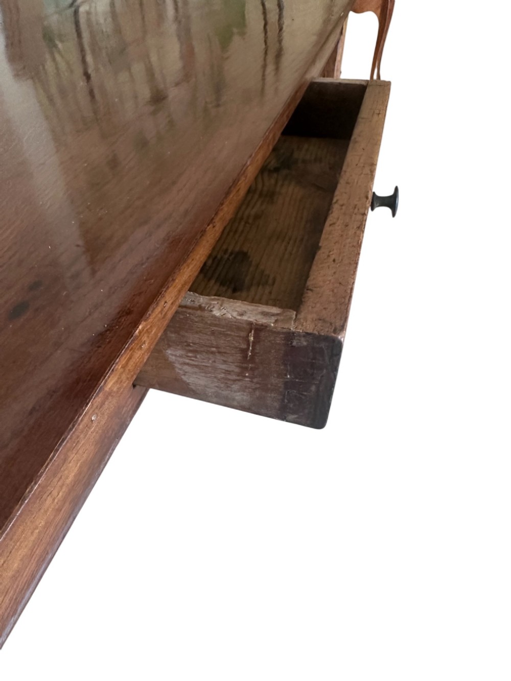 A large nineteenth-century French oak farmhouse table featuring a rectangular plank top, a frieze drawer with a wooden knob, and four tapered square legs. View VII