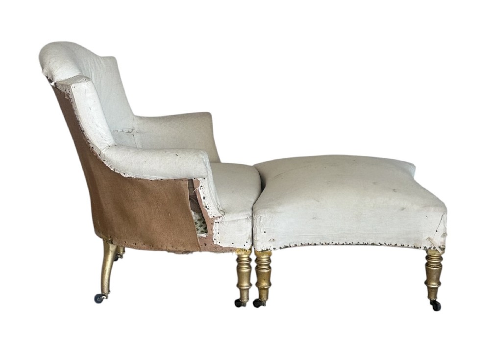 A two-piece late nineteenth-century French duchesse brisee chaise longue in calico upholstery featuring turned gilded legs on castors. View II
