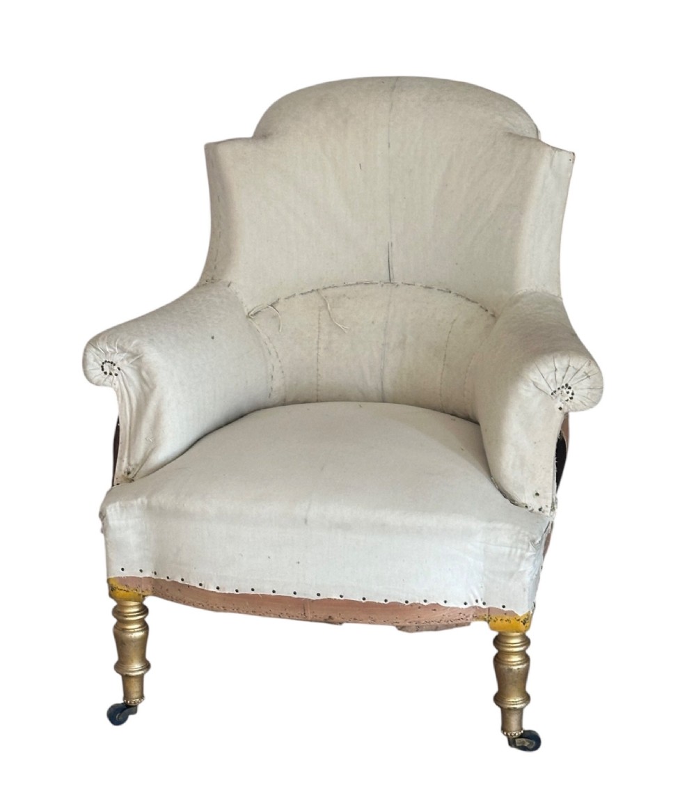 A two-piece late nineteenth-century French duchesse brisee chaise longue in calico upholstery featuring turned gilded legs on castors. View V