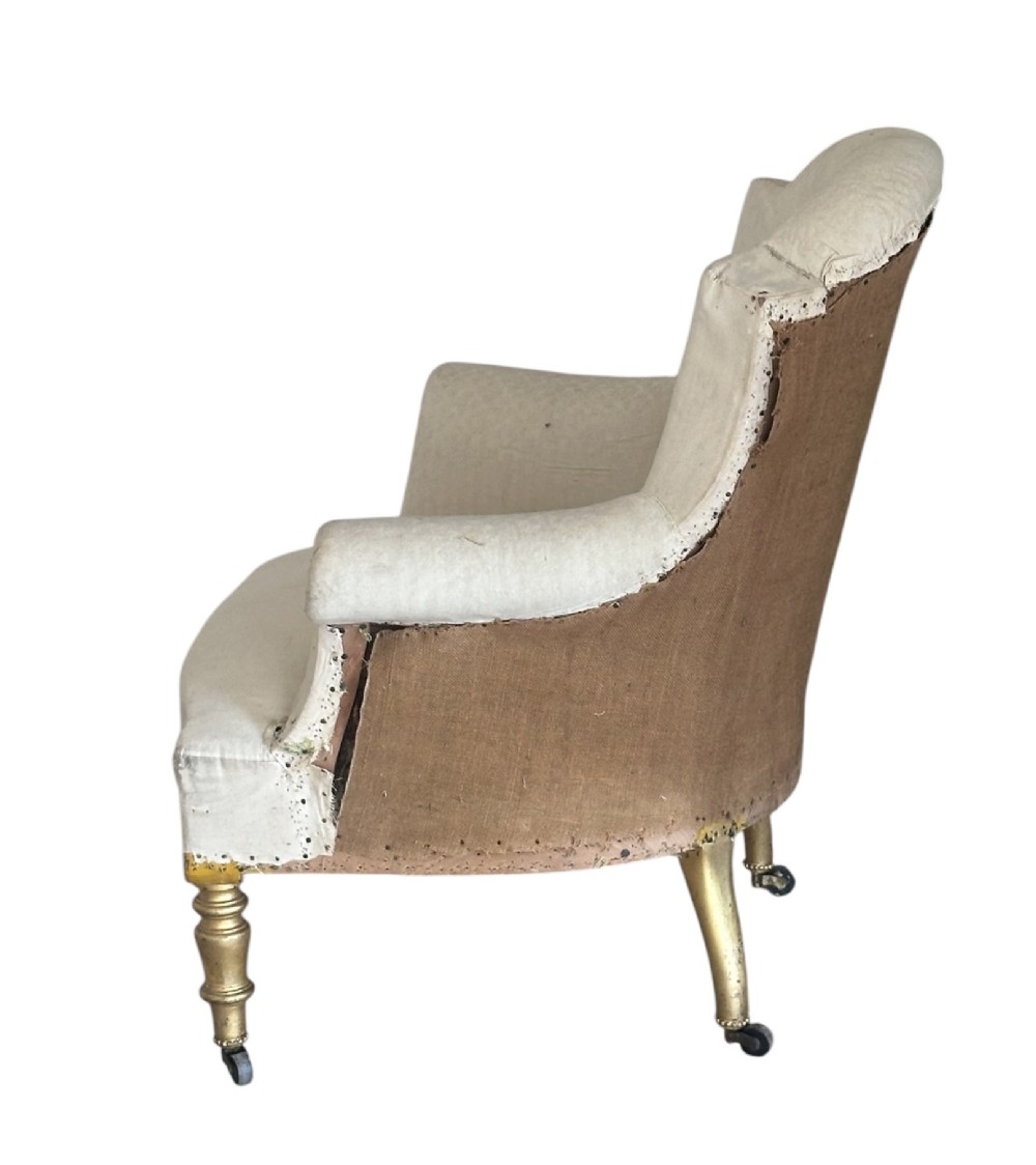 A two-piece late nineteenth-century French duchesse brisee chaise longue in calico upholstery featuring turned gilded legs on castors. View VI