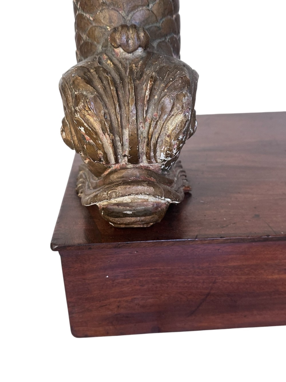 A 19th-century mahogany console table featuring a grey marble top, gilded carved dolphin front supports, and a low plinth base. View IV