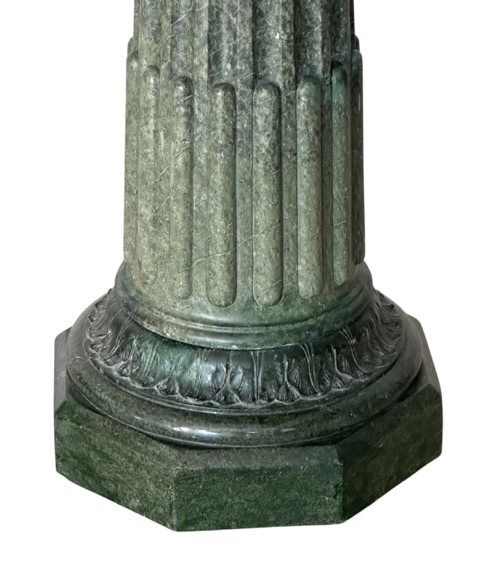 A nineteenth-century French dark green marble column featuring a fluted shaft, carved decorative detailing, and a square top display platform. View II