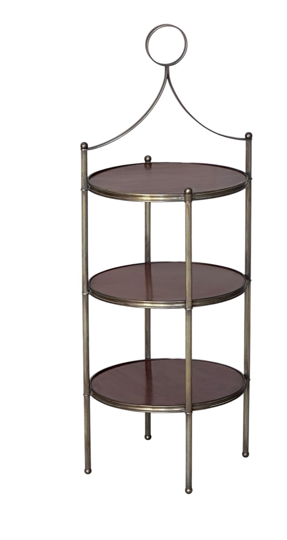 A three-tier mahogany and brass etagere featuring rounded wood shelves, fluted brass uprights, and a top loop handle.