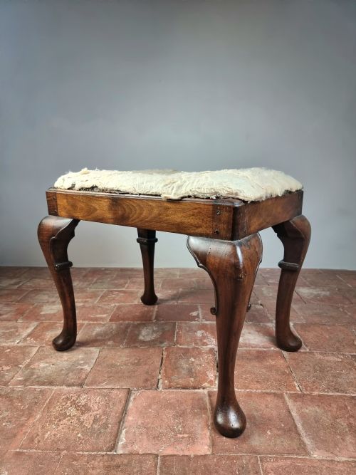 An 18th Century Walnut Stool.