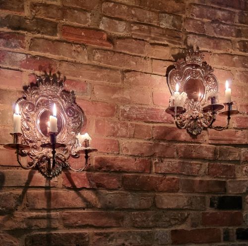 A Pair of 19th Century Repousse Wall Sconces.